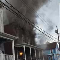 <p>A woman is dead following a three-alarm duplex fire in Cumberland on Tuesday.</p>