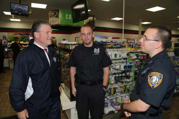 Sen. Terrence Murphy meets with two police officers.