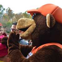 <p>The Briarcliff bear greets kids at the Ragamuffin Parade.</p>