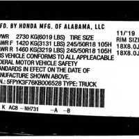 <p>One of the forged federal certification stickers put on a stolen vehicle.</p>