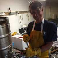 <p>Jeff Fondak, co-owner of Chicken Island Brewery, at work mixing up a batch of their magic brew.</p>