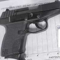 <p>TSA officers stopped a man with this handgun at the Washington Dulles International Airport security checkpoint on April 10.</p>