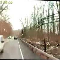 <p>A camera on a bus shows an SUV crossing a double yellow line before hitting the bus.</p>