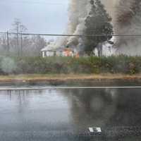 <p>Smoke could be seen as crews battled the house fire on Pulaski Highway in Harford County</p>