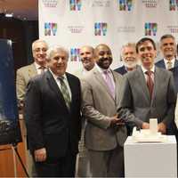 <p>Officials from New Rochelle with members of the team from MacQuesten Development.</p>