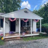 Off-Duty Firefighter Douses House Fire With Garden Hose Through Broken Bedroom Window In MD