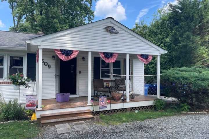 Off-Duty Firefighter Douses House Fire With Garden Hose Through Broken Bedroom Window In MD