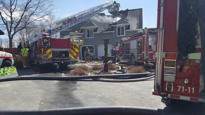 West Clinton firefighters battled a fire that destroyed half of a large multi-family home.