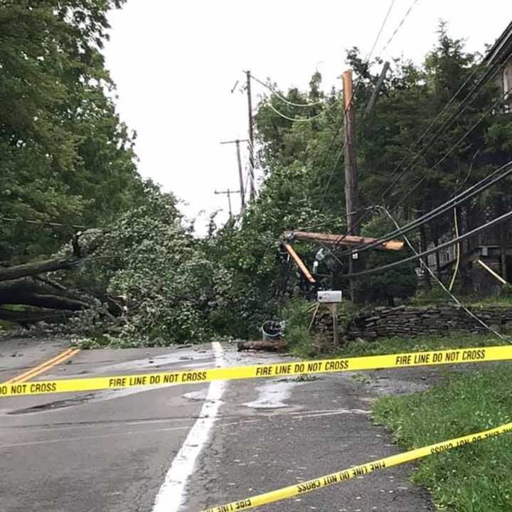 A fallen tree along Middlebush Road in the Town of Wappinger broke a pole and downed wires, caused by strong winds brought by Tropical Storm Isaias.