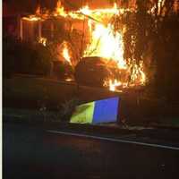 SUV Slams Into Pearl River Home, Sparking Large Fire