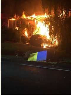 SUV Slams Into Pearl River Home, Sparking Large Fire