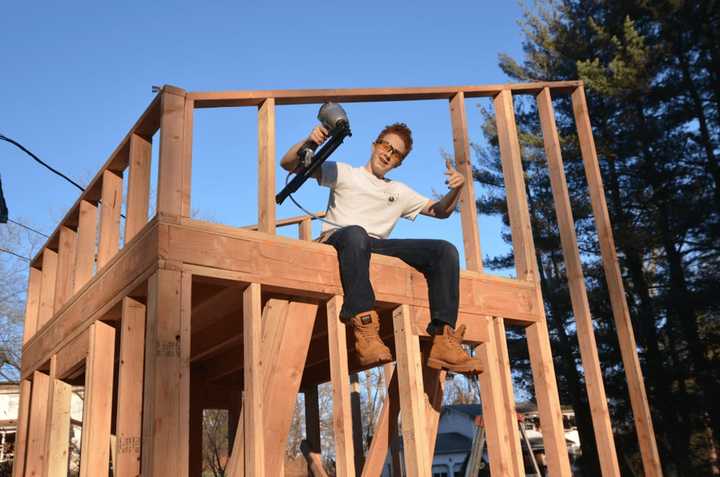 Matthew Olson works on his tiny house.