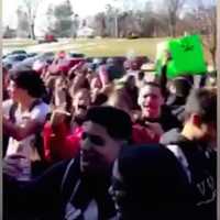 <p>Danbury High students stage a walkout protest Thursday over a harassment incident last month in the parking lot.</p>