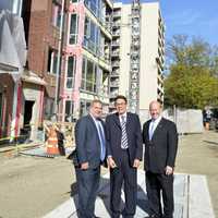 <p>Yonkers Mayor Mike Spano with developers from Ginsberg Development Companies outside of the River of Tides at Greystone at the topping off ceremony.</p>