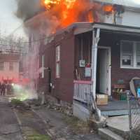 <p>A woman is dead following a three-alarm duplex fire in Cumberland on Tuesday.</p>