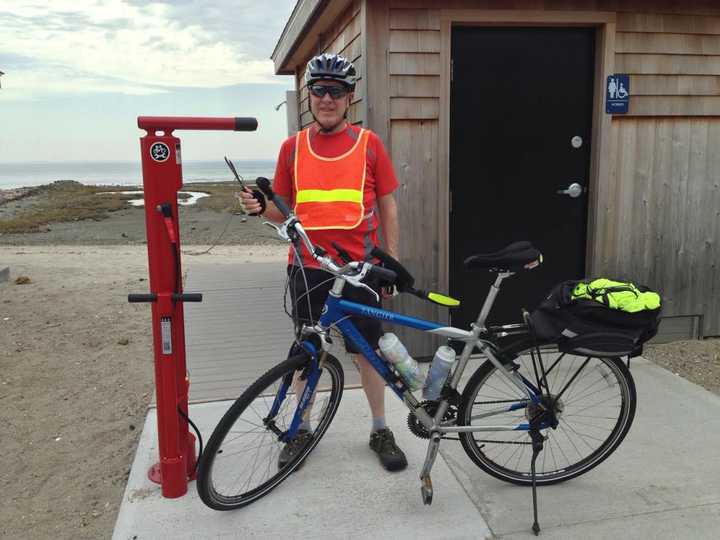 Tim Bezler of Fairfield examines the town’s new stainless steel, tamperproof Bicycle Repair and Air Pump Station at Southport Beach. A second station is in place at Brookside Park near Mill Plain Road.