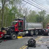 Several Roads Closed Following Crash Between Car, Dump Truck In Area