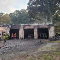Several Cars Destroyed In Three-Bay Maryland Garage Fire, Officials Say