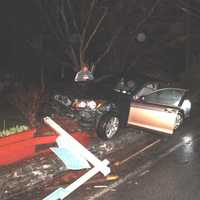 <p>A car landed on top of a brick wall after the driver lost control of his car.</p>