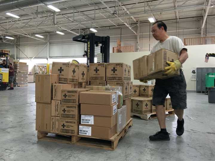 AmeriCares prepares a shipment of first aid supplies for West Virginia in its Stamford warehouse on Monday.