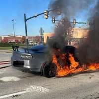 <p>Another angle of the burning car on Route 100 Thursday morning.&nbsp;</p>