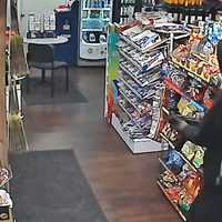 <p>Suspect entering Andy's Convenience store while holding semi-auto in Tewksbury.</p>