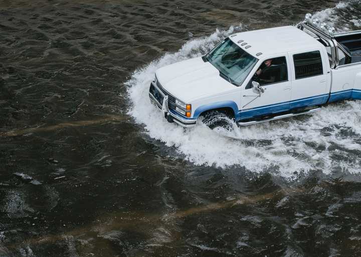 Video posted to social media captured water rising up past vehicles in downtown Lowell