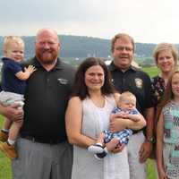 <p>Ryan Forbes, Wendell Metzler with their families in 2017.</p>