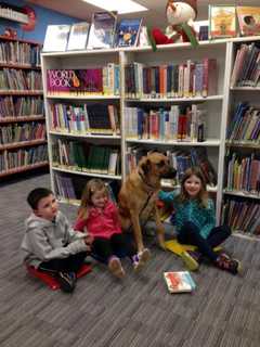 Children Read To Therapy Dog At West Milford Library
