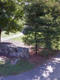 Driver Hospitalized After Slamming Into Pole, Stone Wall In Weston