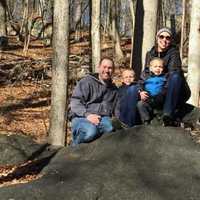 <p>Meg Whitbeck holds her 2-year-old son, Luke, while with her husband, Drew, and son Parker.</p>