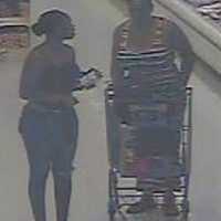 <p>The woman on the right caught on surveillance camera is suspected of stealing from an Islandia supermarket, according to Suffolk County Police.</p>