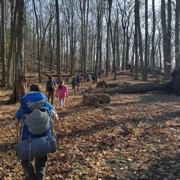 A troop of boy scouts leads some lost hikers back to their camp and out of the woods on Saturday in Harriman State Park in Sloatsburg.