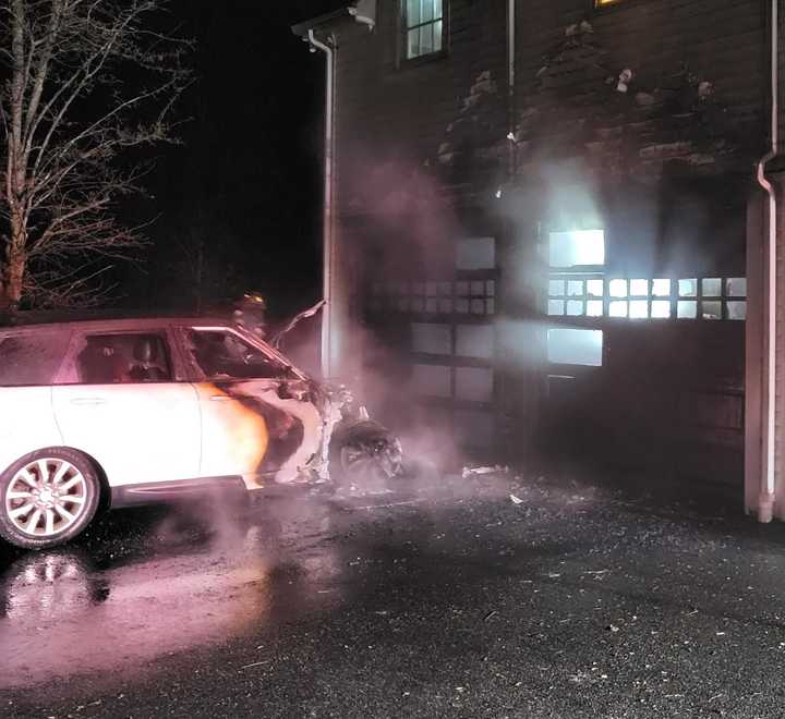 The aftermath of a vehicle fire that leaped onto a house along Sturges Highway in Westport on Saturday evening, Jan. 4. 