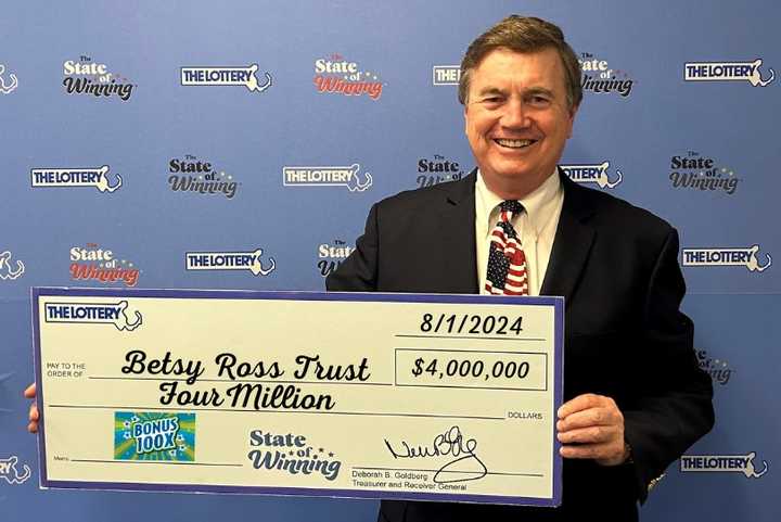 David Spillane, a representative of the Betsy Ross Trust of Quincy, collected the check for the winner.&nbsp; &nbsp; &nbsp;&nbsp;