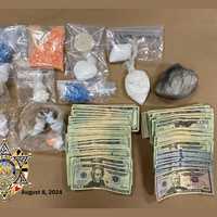 <p>The seized cash and drugs.</p>