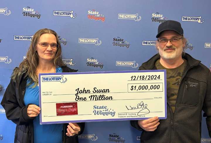 John Swan with his check.