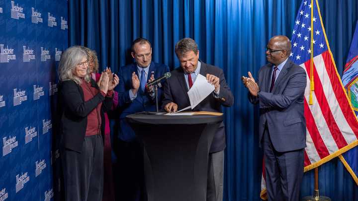 Westchester County Executive George Latimer signs the 2025 County budget. 