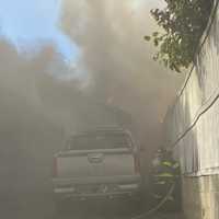 Firefighters Battle Blaze At Norwalk Garage Repair Shop