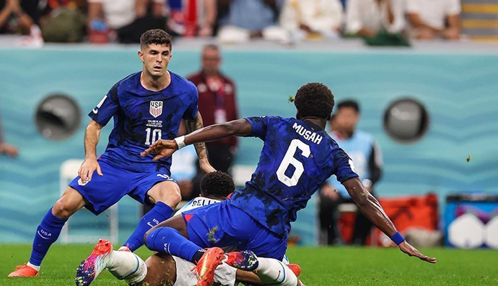 
United States soccer players Christian Pulisic and Yunus Musah during a match in the 2022 FIFA World Cup.
