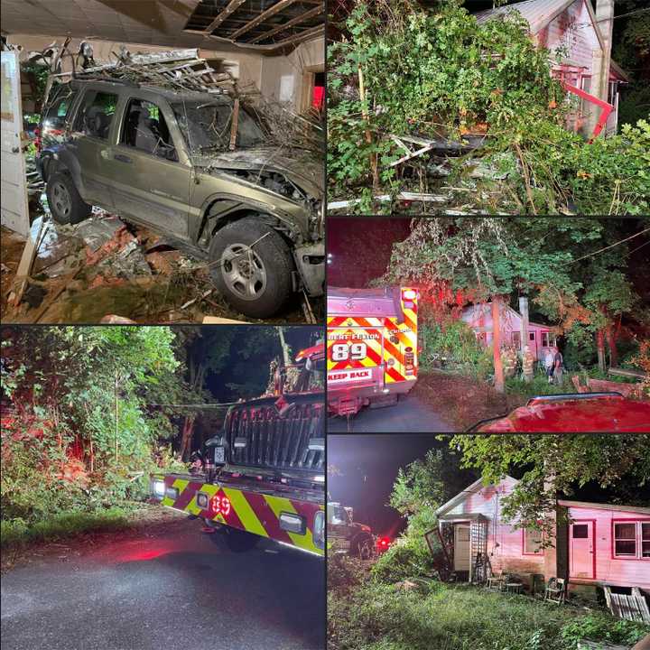 The scene of the empty Jeep Liberty Sport entirely inside a home after slamming into it.&nbsp;