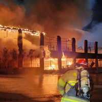 <p>Crews battling the blaze at&nbsp;Tollbooth Antiques Market.</p>