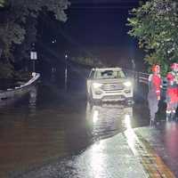 <p>A car in flood waters.</p>