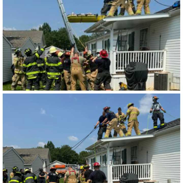 The scene of the firefighters rescuing the unconscious man from the roof of a home.&nbsp;