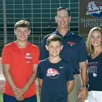 <p>Coach Mac, with Tricia, and their sons Brady and Levi in August 2021.&nbsp;</p>