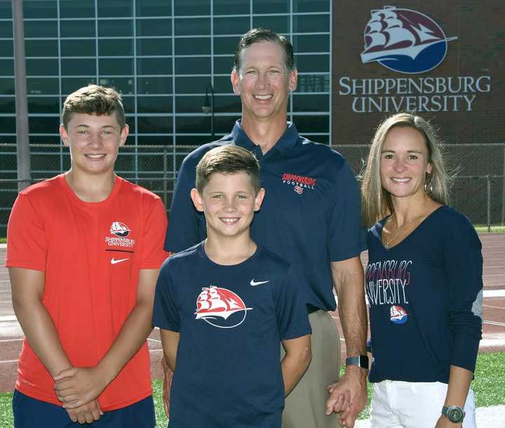 Coach Mac, with Tricia, and their sons Brady and Levi in August 2021.&nbsp;