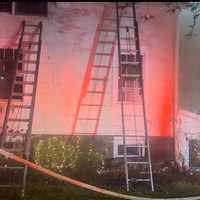 <p>Crews battle a blaze at 238 Silvermine Ave in Norwalk Monday evening, Dec. 16. </p>