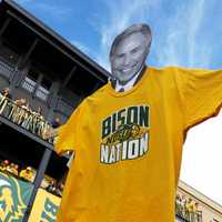 <p>A fan holds up a cardboard cutout of ESPN analyst Lee Corso wearing a North Dakota State Bison shirt during College GameDay in Fargo, ND, on September 13, 2014.
  
</p>