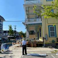 <p>Firefighters respond to the scene of a garbage truck that crashed into a building in Cape May, NJ.</p>