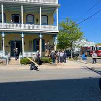 <p>Firefighters respond to the scene of a garbage truck that crashed into a building in Cape May, NJ.</p>